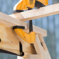 folding sawhorse with clamp attached
